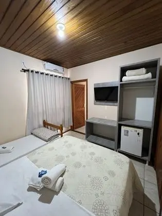 Quarto triplo com varanda