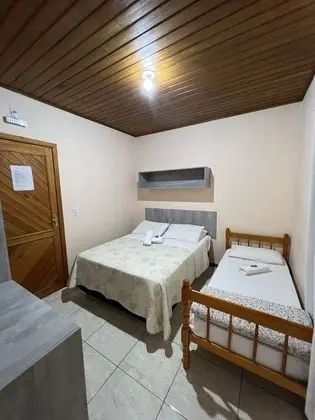 Quarto triplo com varanda