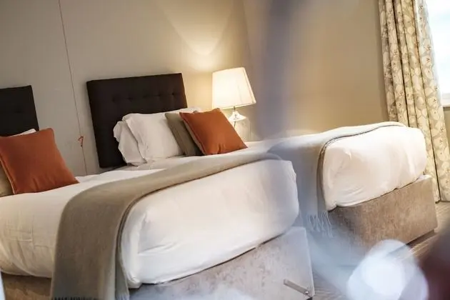 Deluxe Tek Büyük veya İki Ayrı Yataklı Oda (Shower)