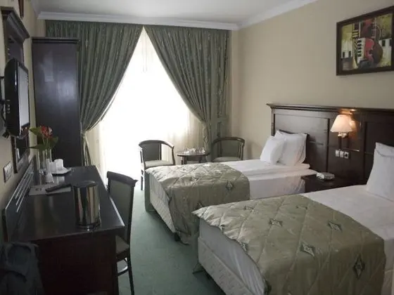 Deluxe Tek Büyük veya İki Ayrı Yataklı Oda