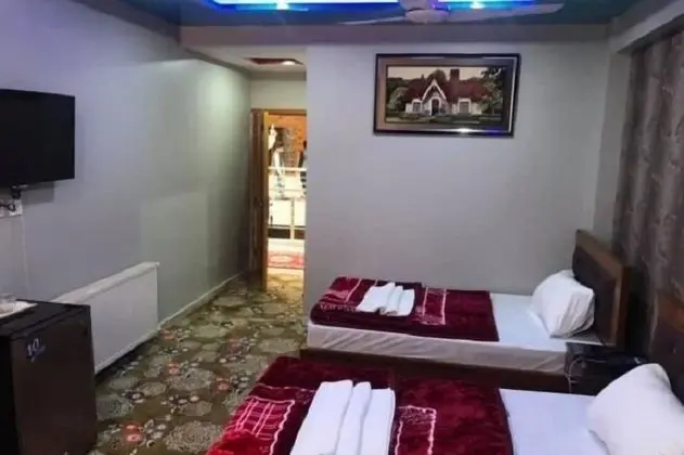 Deluxe Tek Büyük veya İki Ayrı Yataklı Oda