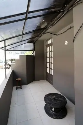 Quarto compartilhado misto de 9 camas con terraco