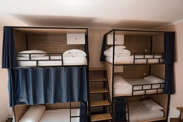 Bed in a 12-person mixed dormitory with balcony