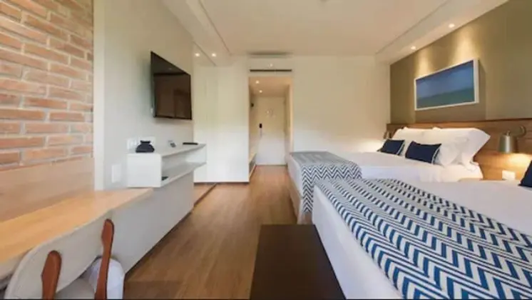 Quarto Standard - 1 cama queen e 1 cama solteiro. Vista jardim ou mangue