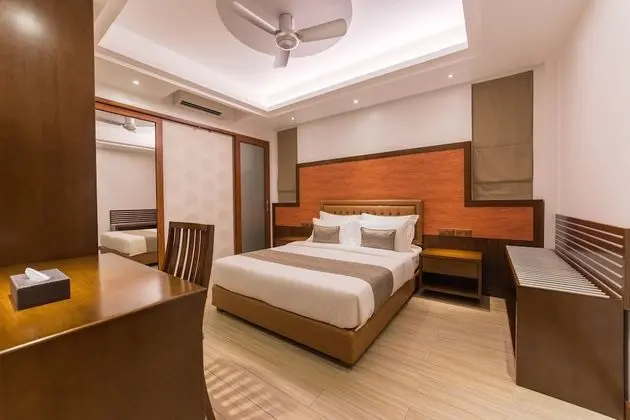 Super Deluxe Room with Balcony & Free Return Airport Transfer