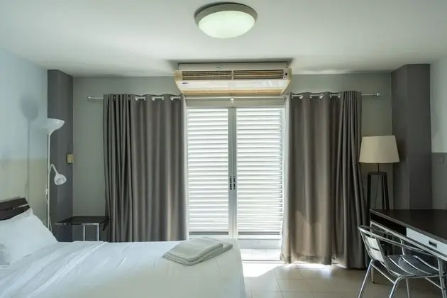 City Balcony Studio Apartment: Queen Bed + Sofa Bed + Working Desk