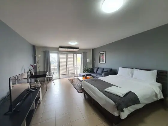 City Balcony Studio Apartment: Queen Bed + Sofa Bed + Working Desk