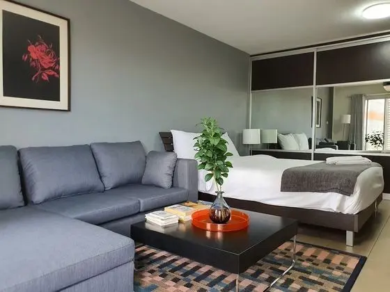 City Balcony Studio Apartment: Queen Bed + Sofa Bed + Working Desk