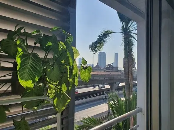 City Balcony Studio Apartment: Queen Bed + Sofa Bed + Working Desk