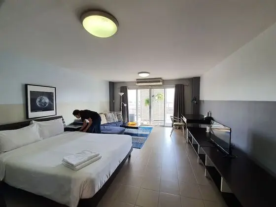 City Balcony Studio Apartment: Queen Bed + Sofa Bed + Working Desk