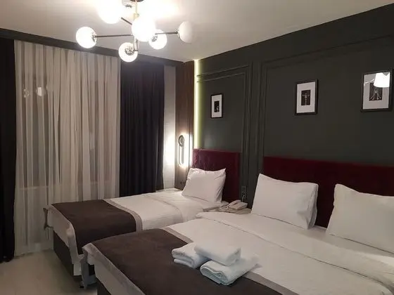 Deluxe Tek Büyük veya İki Ayrı Yataklı Oda