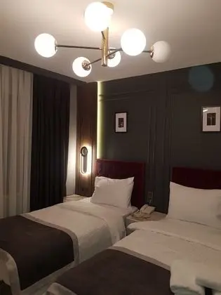 Deluxe Tek Büyük veya İki Ayrı Yataklı Oda