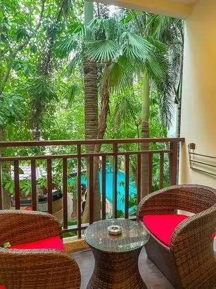 Deluxe Balcony King Garden View