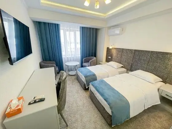 Deluxe Tek Büyük veya İki Ayrı Yataklı Oda