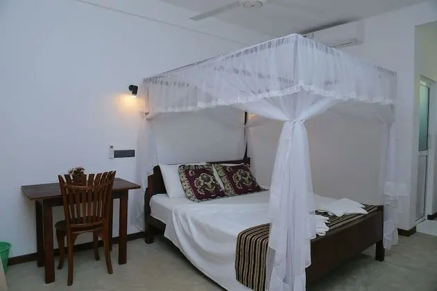 Deluxe Üç Kişilik Oda, Birden Çok Yatak, Sigara İçilmez, Bahçe Manzaralı