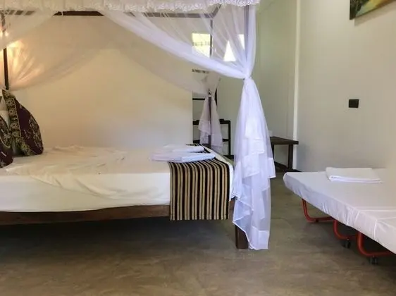 Deluxe Üç Kişilik Oda, Birden Çok Yatak, Sigara İçilmez, Bahçe Manzaralı