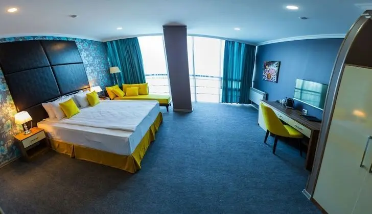Deluxe Tek Büyük veya İki Ayrı Yataklı Oda