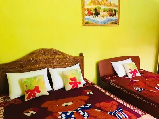 Deluxe Üç Kişilik Oda, Birden Çok Yatak, Sigara İçilebilir, Bahçe Manzaralı