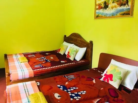 Deluxe Üç Kişilik Oda, Birden Çok Yatak, Sigara İçilebilir, Bahçe Manzaralı