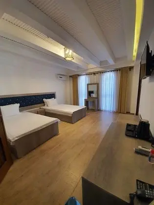 Business Tek Büyük veya İki Ayrı Yataklı Oda