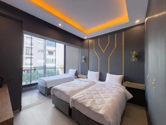 Deluxe Oda Triple,Kısmi Deniz Manzaralı,Balkonsuz