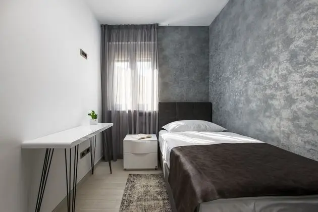 Deluxe apartment with two bedrooms, terrace, and garden view