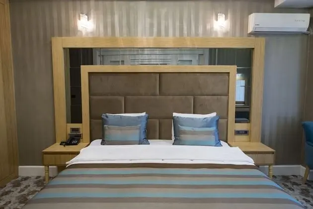 Deluxe Tek Büyük veya İki Ayrı Yataklı Oda