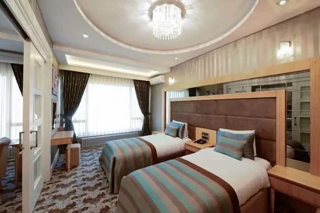 Deluxe Tek Büyük veya İki Ayrı Yataklı Oda