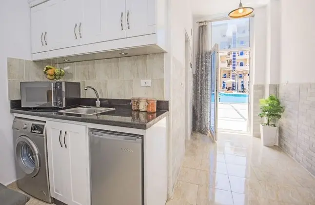 Poolside, Patio, Washing Machine, Kitchenette | Tiba Resort P4