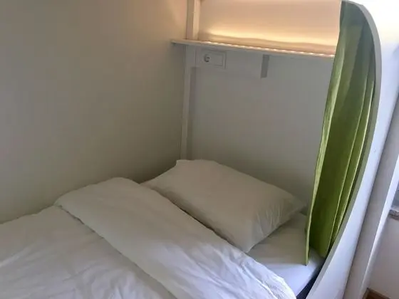 Private sleeping pod in 12 people dormitory