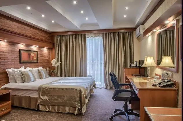Deluxe Tek Büyük veya İki Ayrı Yataklı Oda