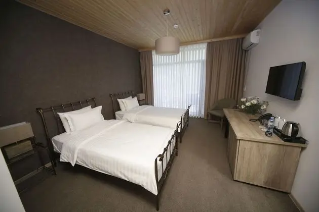Deluxe Tek Büyük veya İki Ayrı Yataklı Oda