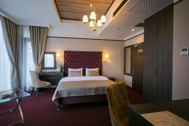 Deluxe Tek Büyük veya İki Ayrı Yataklı Oda