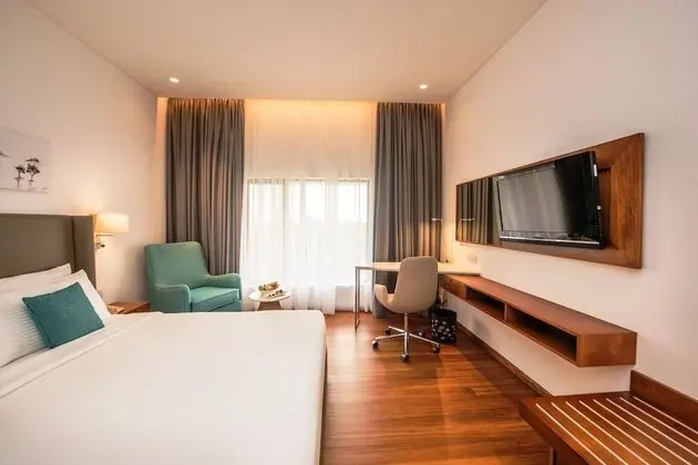 Deluxe King Room with One way Airport Transfer including 15% off on F&B & Spa