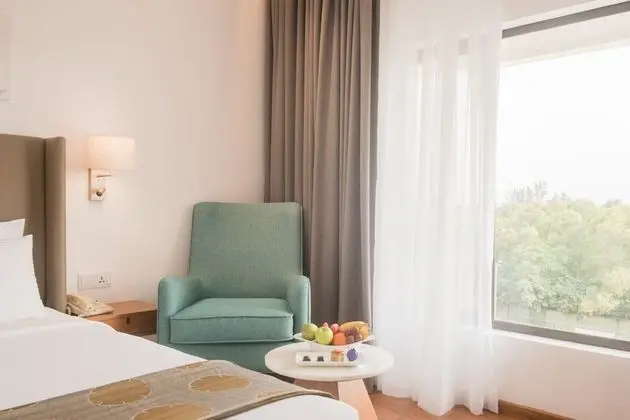 Deluxe King Room with One way Airport Transfer including 15% off on F&B & Spa