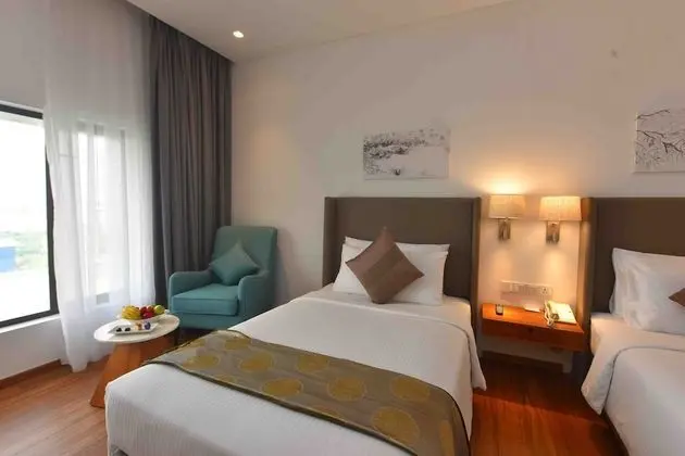 Deluxe Twin Room with One way Airport Transfer including 15% off on F&B & Spa