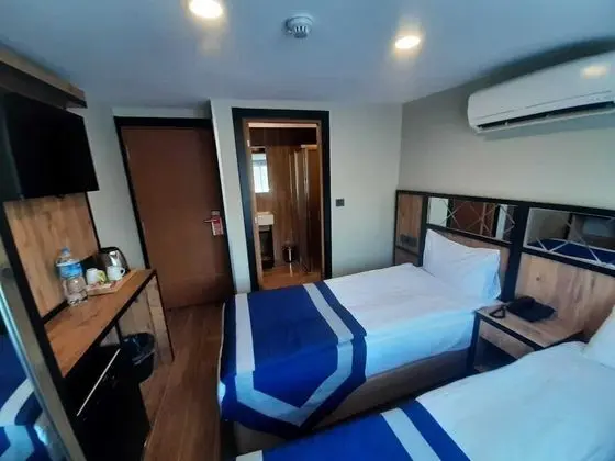 Deluxe Tek Büyük veya İki Ayrı Yataklı Oda, 1 Çift Kişilik veya 2 Tek Kişilik Yatak