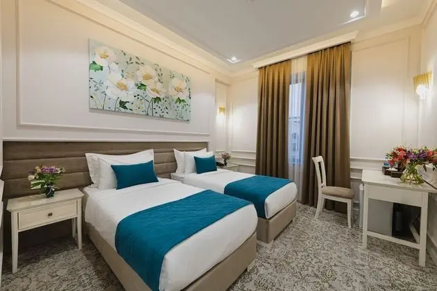 Deluxe Tek Büyük veya İki Ayrı Yataklı Oda